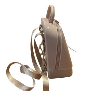 Pink mini backpack or crossbody bag with adjustable straps and handle nude color